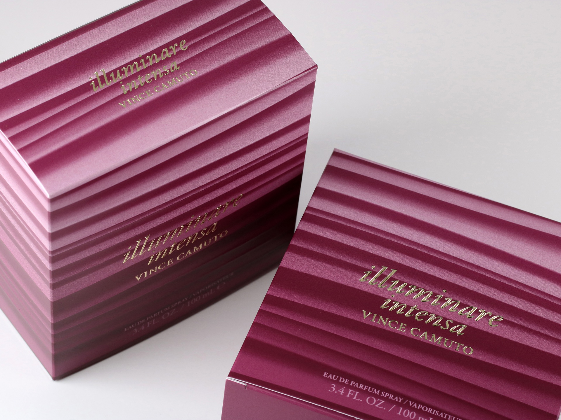 Illuminare Intensa Vince Camuto folding cartons features gold hot foil stamping and multi-level embossing.