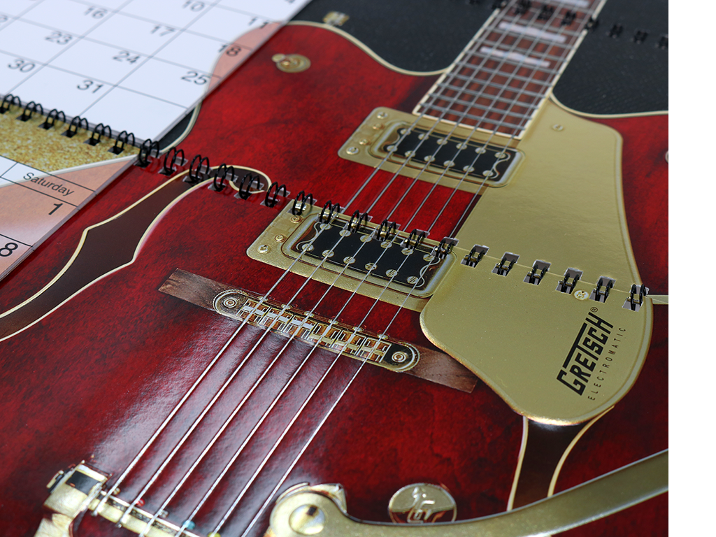 Tightly-registered UV coatings were used to enhance the design and highlight the individual guitar components.
